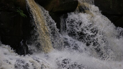 Fototapeta na wymiar Flow of the waterfall