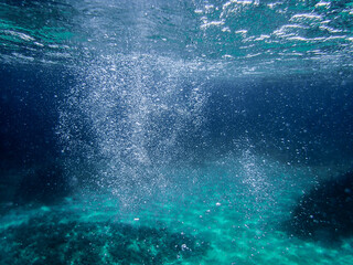 Bubbles under the sea in the crystal clear green sea water. Mediterranean bubbles. Real image very suitable for backgrounds, Rising Bubbles in Deep Underwater, Under with bubble. Great for background.