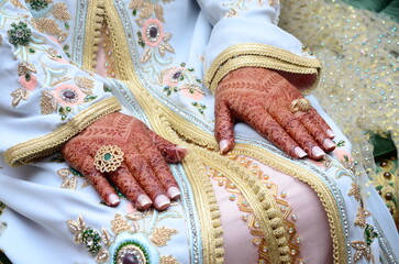 Henna Tattoo on Bride's Hand.Moroccan wedding preparation henna party. Temperate white mehndi....
