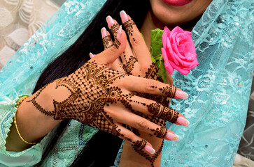 Henna Tattoo on Bride's Hand.Moroccan wedding preparation henna party. Temperate white mehndi....