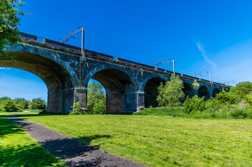 A view towards the fourteen arches viaduct at Wolverton, UK in summertime