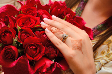 An Arab bride puts a henna tattoo with her wedding ring. Islamic marriage