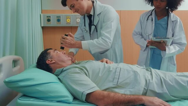 Doctor doing cardio pulmonary resuscitation on an unconscious patient..