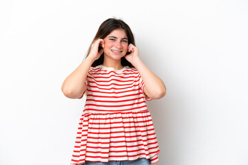 Young caucasian woman isolated on white background frustrated and covering ears