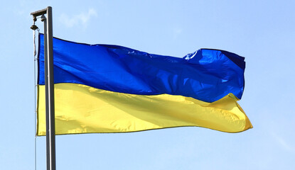The flag of Ukraine against blue sky as symbol of Ukrainian freedom, Ukrainian independence and the Ukrainian nation