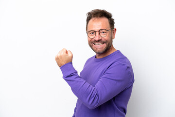 Fototapeta premium Middle age caucasian man isolated on white background celebrating a victory