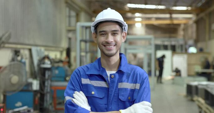 Young worker working in industry factory.