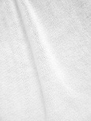 White clean wool texture background. light natural sheep wool fabric. white seamless cotton. texture of fluffy fur for designers. close-up fragment white wool carpet.
