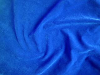 Fototapeta na wymiar Blue velvet fabric texture used as background. Empty blue fabric background of soft and smooth textile material. There is space for text..