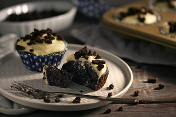 chocolate muffin with vanilla cream on the top