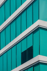 Low angle view of blue roller blinds inside of modern glass office building in minimal style and...