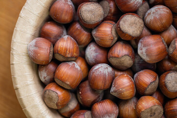 hazelnut in a wooden bowl close up
