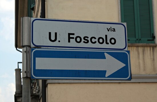 Italy: Two Road signal (1- Ugo Foscolo Street. 2) Directional Arrow.