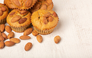 Muffins with flaked almond nuts. Cupcakes with nut chips. Top view