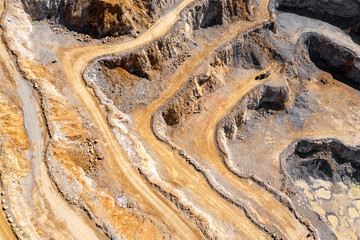 Industrial terraces in a mining quarry. Aerial view of open pit mining. Excavation of the Dolomite...