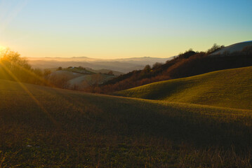 Fototapeta premium hills at sunset in winter season nearby Pesaro, Marche Region, Italy