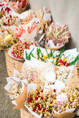 bouquets of dried flowers in a basket
