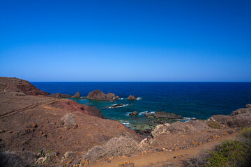 View of the lava beach of Linosa Called Faraglioni