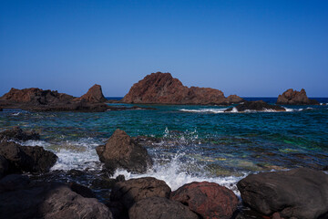 View of the lava beach of Linosa Called Faraglioni