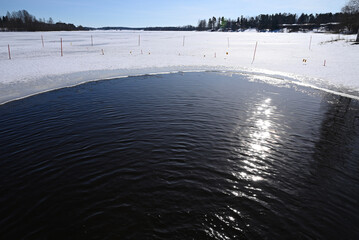 frozen lake in winter, opening on the lake