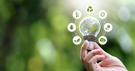 ESG Banners - Environment, Society and Governance hand holding light bulb with renewable energy icon Revolving Revenue - obrazy, fototapety, plakaty