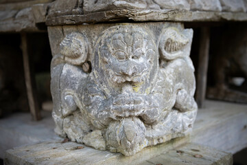 Fototapeta na wymiar Ancient Balinese wood artistic piece from an altar 