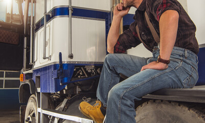 Semi Truck Driver Waiting For His Trailer to be Loaded