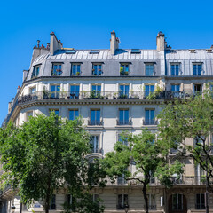 Paris, typical facade boulevard Magenta, beautiful building, with old zinc roofs
