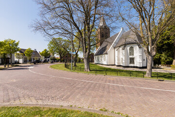 Fototapeta na wymiar Village church of the small picturesque Dutch village of Zoelmond in the Betuwe.