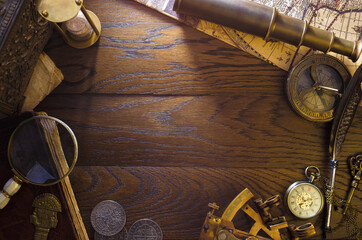 Vintage captain's desk. Adventure and travel concept. Still life on shipboard oak boards.