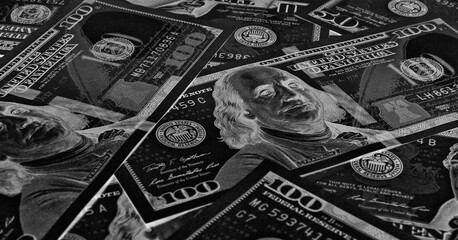 American paper money. 100 dollar and other US notes. Dark black and white horizontal stories. Savings economy and the USA dollar. Dark inverted photos. Fed and federal funds rate