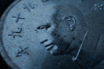 Translation: 2010. 1 one Taiwanese dollar or yuan. Taiwan money. Fragment of textured coin. Blue...