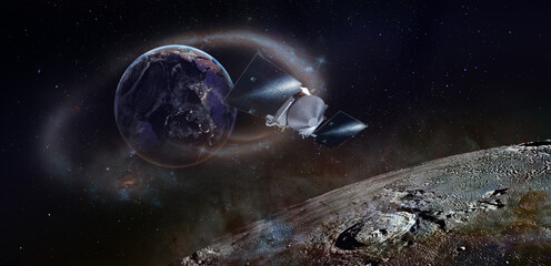 Moon surface and planet Earth with spaceship flying around. Elements of this image furnished by...