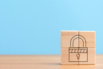 Wooden cubes on blue background with icon of seo secure protection lock security, concept
