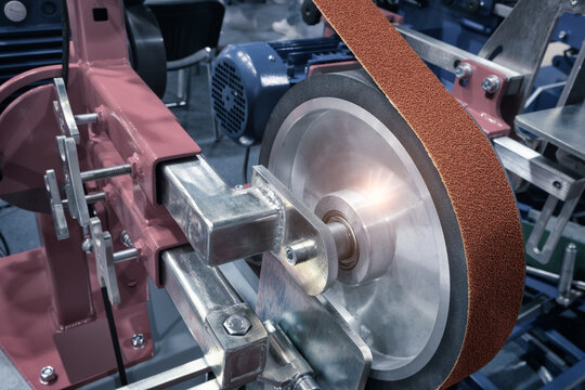 abrasive treatment tools, belt grinder, Close-up, industrial metalworking concept