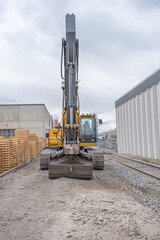 Excavator digging at contruction site for a new building