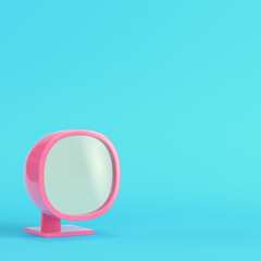 Pink old-styled monitor on bright blue background in pastel colors