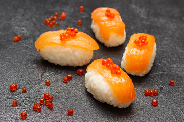 Salmon nigiri with caviar. Top view.