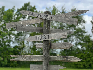 Sign with sunset and harlingen