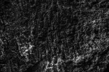Fototapeta na wymiar Grunge Rough structure. Black texture. Stone background. Dark marble. Rock texture. Rock surface with cracks. Rock pile. Paint spots wall. Abstract texture.