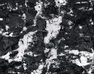 Rock surface with cracks. Black texture. Stone background. Dark marble. Rock texture. Rock pile. Paint spots wall. Grunge Rough structure. Abstract texture.