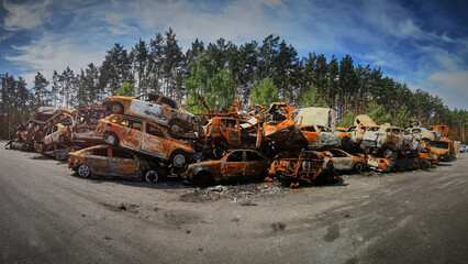 A lot of rusty burnt cars in Irpen, after being shot by the Russian military.