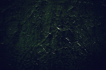 Rock surface with cracks. Black texture. Stone background. Dark marble. Rock texture. Rock pile. Paint spots wall. Grunge Rough structure. Abstract texture.