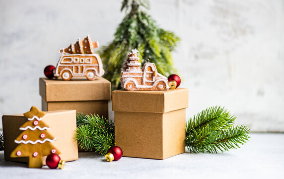 Christmas gingerbread cookies on gift boxes with a Christmas tree ornament