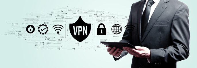 Obraz premium VPN concept with businessman holding a tablet computer