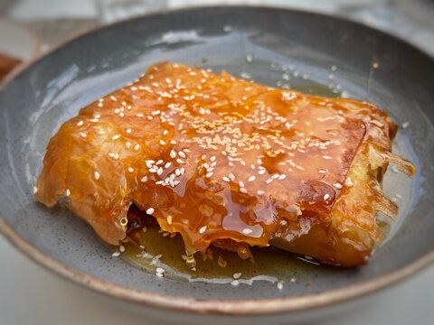 Feta cheese in filo pastry with honey and sesame seeds