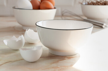 Cooking in the kitchen. White and brown eggs. Preparing breakfast. selective focus