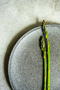 Overhead view of two asparagus spears on a plate