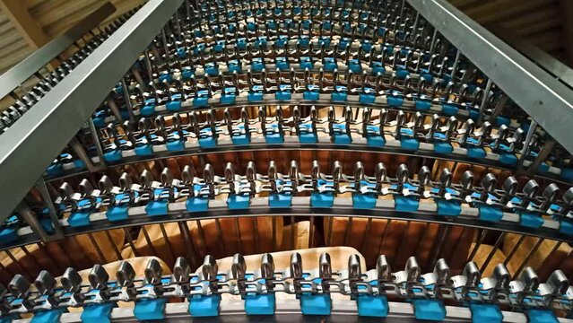 Loafs of bread in a bakery on an automated conveyor belt