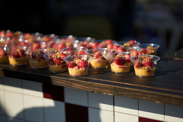 Sweet snack with strawberries. portioned dessert with strawberries. catering.